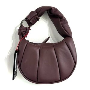 Tumi Asra Small Crossbody Cabernet Puff leather purple sunset